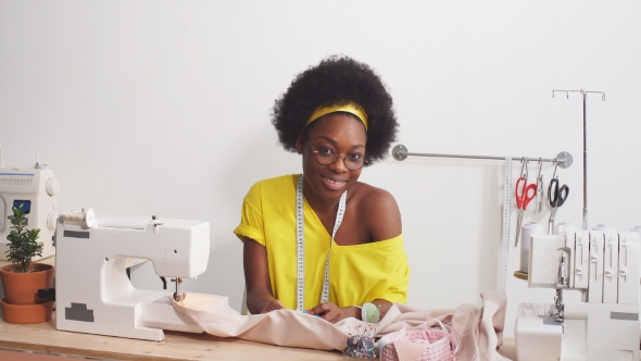 Attractive Fashion Designer Working at Home Studio