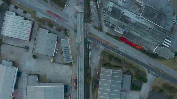 Slow flyover above train line under construction to connect overpass infrastructure.