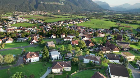 Aerial View of Liechtenstein with Houses on Green Fields in Alps Mountain Valley