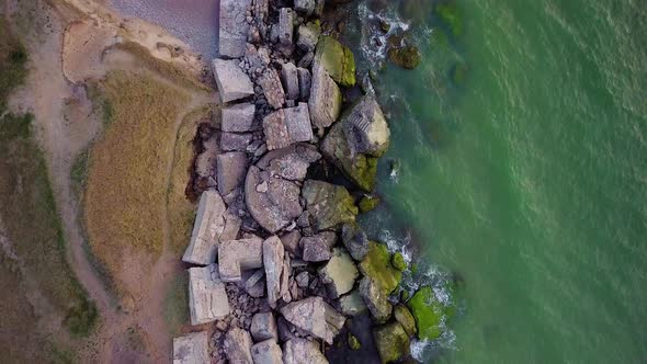 Aerial birdseye view of abandoned seaside fortification buildings at Karosta Northern Forts on the b