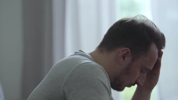 Portrait of Stressed Man at Home