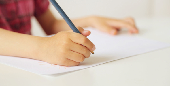 Child's Hands With Pencil