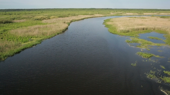 Aerial View of Bog Lands Near the River Valley