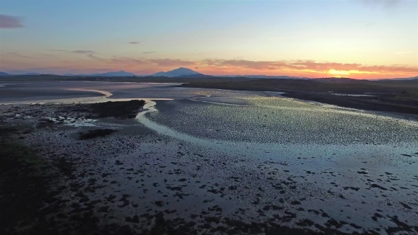 Flying Over the Mud Bay Into the Sunset