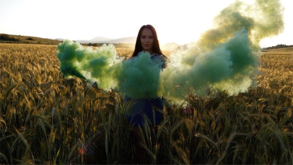 Woman with a Smoke in a Wheat Field
