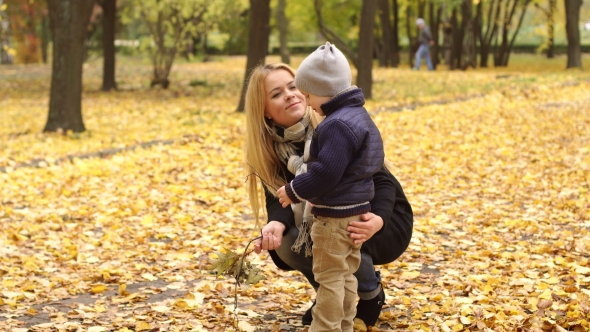 Portrait of a Mother and Her Son in Autumn Park