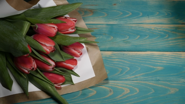 Love Message Note and Tulips Flowers Bouquet on a Wooden Table Love Relationship