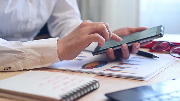 Businesswoman Monitoring Stock Data