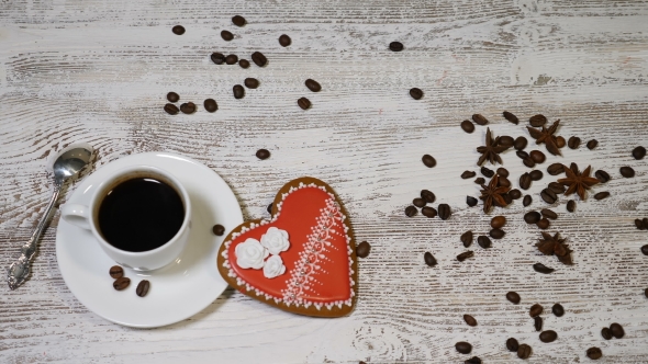 Love Relations St Valentine Concept of Cup of Coffee and a Ginger Biscuit Heart Shaped