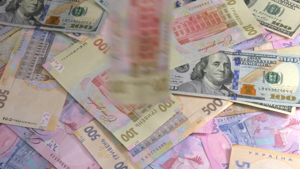 Old and New Money Dollar and Hryvnia Is Falling on the Table