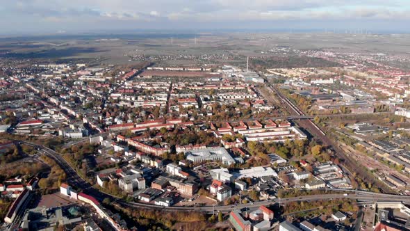 Village in scenic rural landscape in Magdeburg Germany, descending aerial