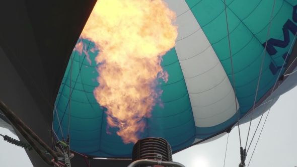 Hot Air Balloon. Burner Directing Flame Into Envelope 