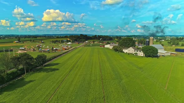 Aerial View of Amish Farm lands With a Single Rail Road Track