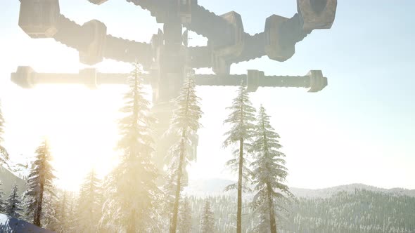 UFO Hovering Over a Forest at Sunset with Light Beam alt