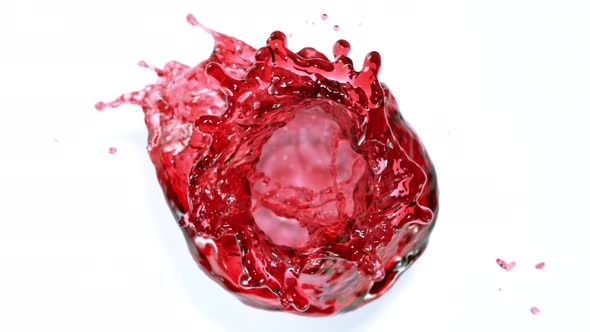 Super Slow Motion Shot of Red Wine Vortex Splash Isolated on White Background at 1000 Fps