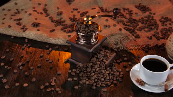 White Cup with Black Coffee on a Saucer with Cinnamon