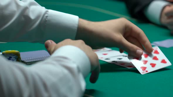 Man Winning Poker, Grasping Tokens and House Keys, Fortunate Evening, Closeup