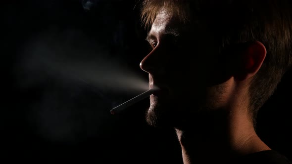 Man Mouth Smoking Cigarette. Backlight. Close Up