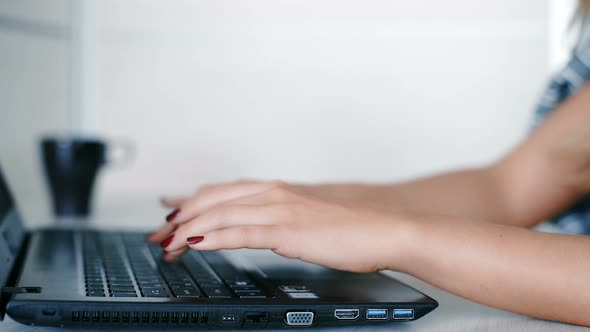 Female Hands Typing on Laptop