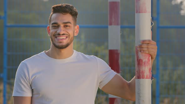 Young Smiling Athletic Middle Eastern Indian Sportsman Coach Goalkeeper or Footballer in Summer