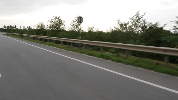 Shot of metal safety barrier on both sides of road