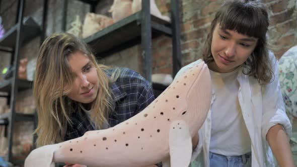 Attractive Smiling People in Process of Making Wonderful Work of Clay