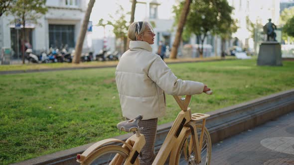 Woman with Bicycle Looking Away