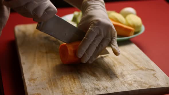 The Cook Cut the Carrot in Very Pleasant Atmosphere