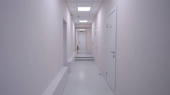 Panning Shot of White Medical Clinic Hallway with No People