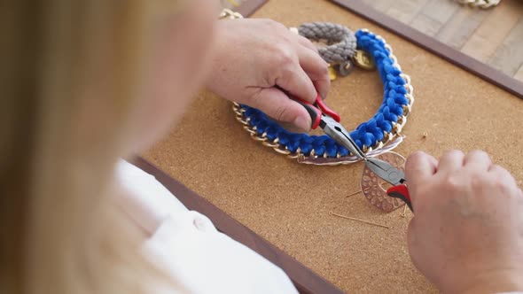 Over the Shoulder Closeup Shot of Woman Making Handmade Jewelry