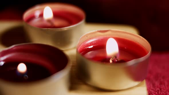 Three Burning Tea Lights Candles