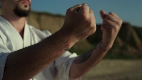 Judo Man Warming Up Hands on Nature Close Up