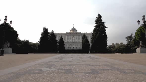 Travelling forward in Jardines de Sabatini  approaching the Palacio Real in Madrid