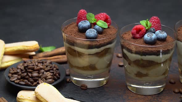 Tiramisu Dessert with Blueberries and Raspberries in a Glass and Savoiardi Cookies