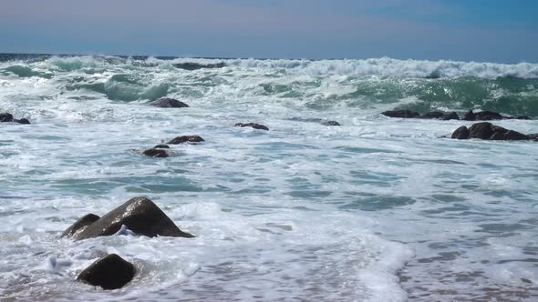 Waves of the Atlantic Ocean crash on Beach