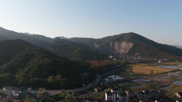 Mountain village and farmland in the sunset