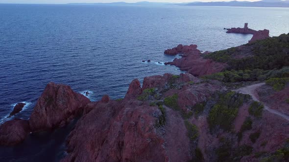 A beautiful aerial landscape of the coast of France and the Golden Island at sunset