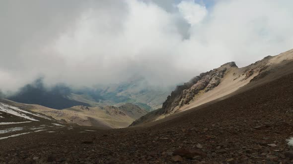 Heavy clouds slowly moving towards camera in High Atlas mountains, Morocco