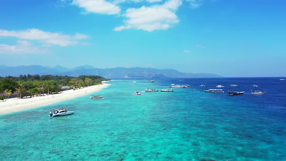 Many tour boats on the pier of exotic island shore, tropical beauty in Malaysia