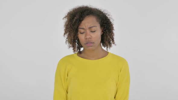 Young African Woman Feeling Sad on White Background