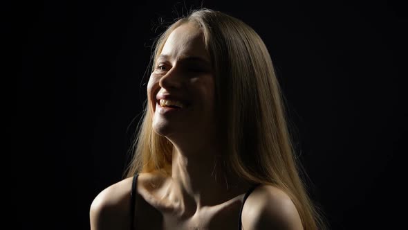 Cheerful Woman Laughing Isolated on Dark Background, Positive Thinking, Emotions