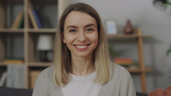 Caucasian Young Woman Resting on Comfy Couch