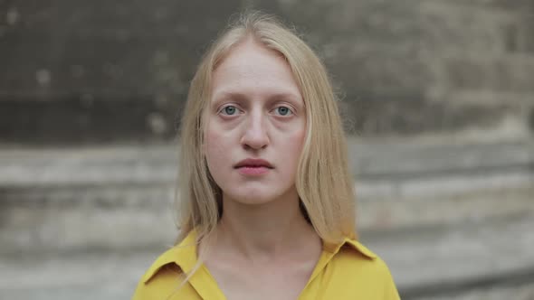 Close Up View of Serious Woman Turning Head and Looking To Camera. Portrait of Sad Female Person