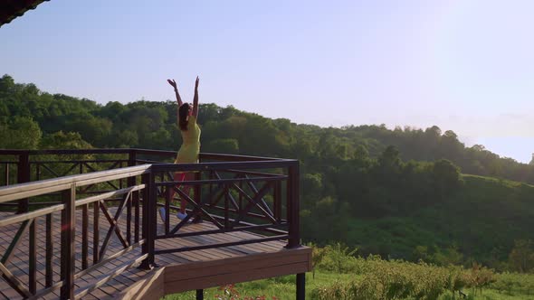 Happy Woman is Enjoying Picturesque Landscape in Highland in Summer Day