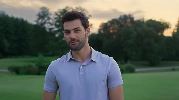 Happy Golf Man Smiling Look Camera on Sunset Field