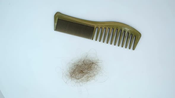 Vertical orientation video: Hairbrush with fallen out hair