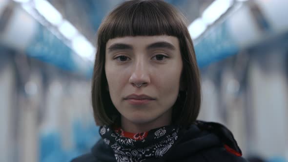 Portrait of Woman with Piercing in Nose Riding at Metro