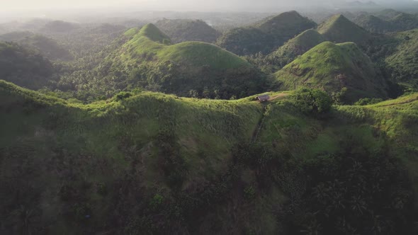 Green Hill Ranges Aerial Mount Top Building with Path at Tropical Greenery