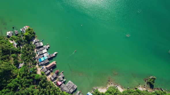 Aerial shot of local fisherman village beside the sea