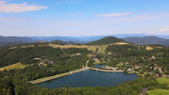 Aerial view of Vindsachtske lake in the village of Stiavnicke Bane in Slovakia